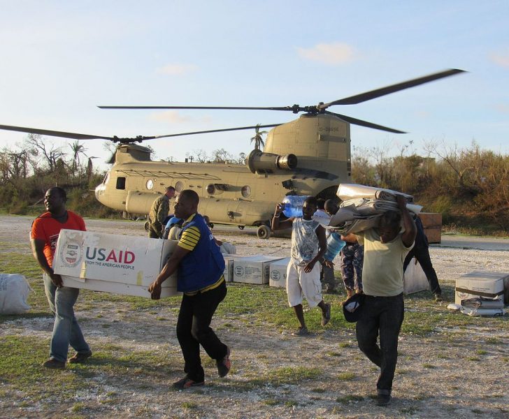Service members from Joint Task Force Matthew and representatives from the United States Agency of International Development delivered relief supplies to areas affected by Hurricane Matthew to Jeremie, Haiti. Photo via the official U.S. Navy Page, from United States of America Capt. Tyler Hopkins/U.S. Navy [Public domain], via Wikimedia Commons