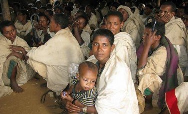 Displaced Amharas waiting for food and shelter. Photo courtesy of Ethiopian Satellite Television. 