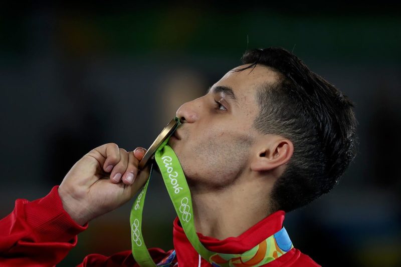 Ahmad Abughaush kisses the gold medal he won for Jordan in the 2016 Olympics in RioTaekwondo PHOTO: Salem Khamis (CC BY-SA 4.0) via Wikimedia Commons