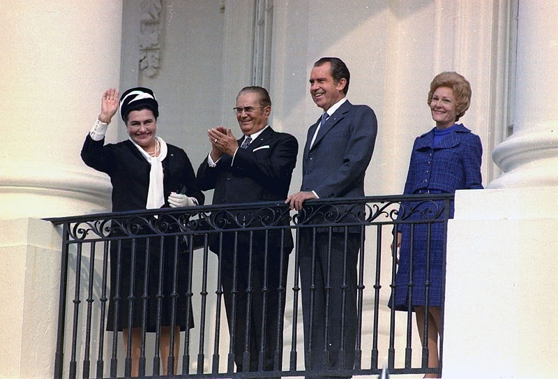 President Josip Broz Tito and Mrs. Broz, President Richard Nixon and Mrs. Nixon overlooking arrival ceremony on the South Lawn from the South Balcony of the White House; photo form the  White House Photo Office Collection, public domain. 