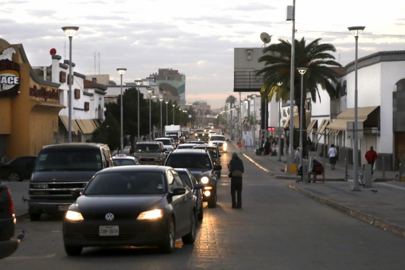 A line of cars forms down Calle Juarez in the early morning at the Puente Internacional Paso Del Norte. The cars are waiting to cross the bridge into El Paso, Texas. Credit: Miguel Gutierrez Jr./KUT News. Used with permission.
