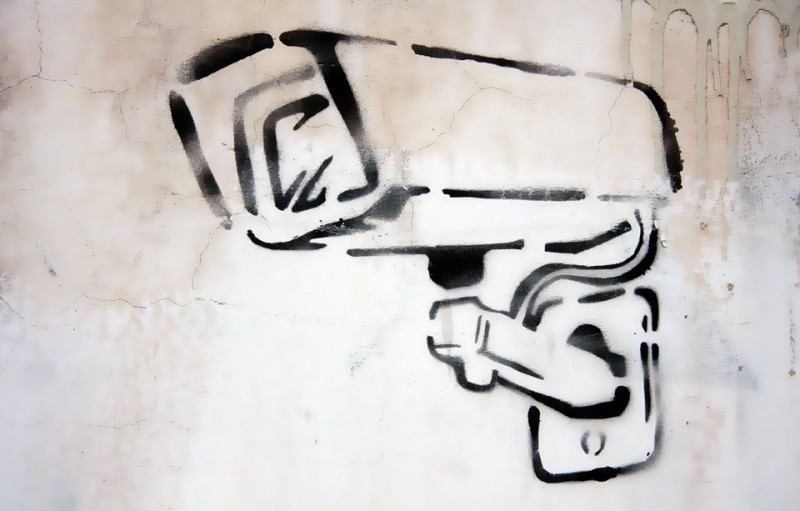 Graffiti art of surveillance camera. Published and labeled for reuse on Pixabay.