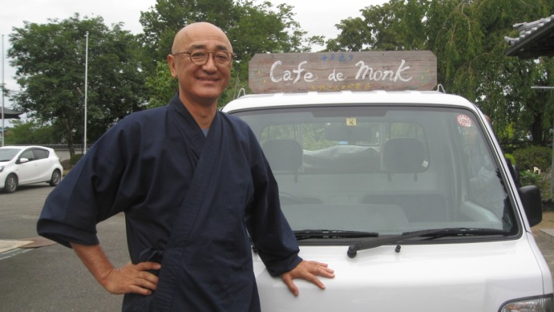 Taio Kaneta with his signature "Cafe de Monk" truck that he uses for his pop-up cafes. As a Buddhist monk, Kaneta wanted to offer something special to those still reeling from the triple disaster of earthquake, tsunami and nuclear meltdown. Credit: Naomi Gingold. Used with PRI's permission