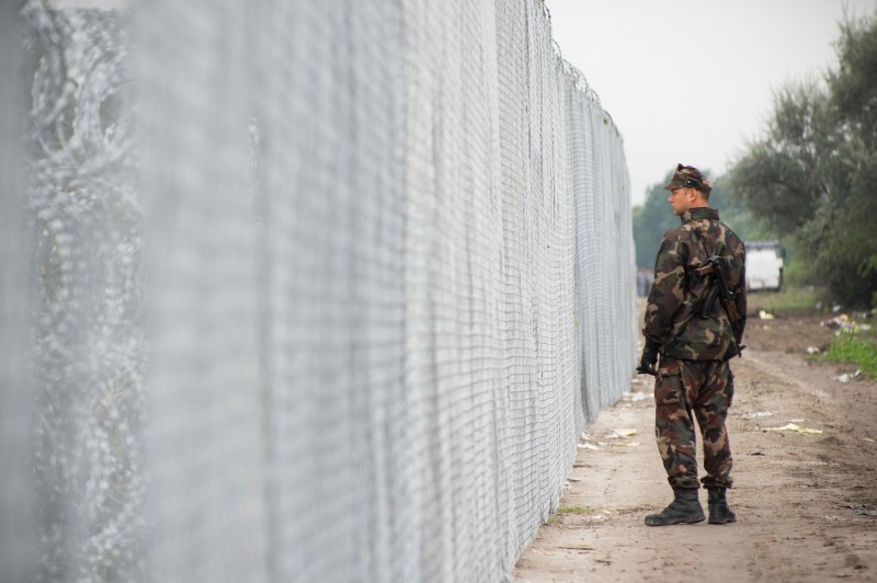 Hungarian military seen patrolling the border beside the newly built fences to control the flow of refugees crossing into Hungary. Photo by Geovien So, copyright Demotix. 