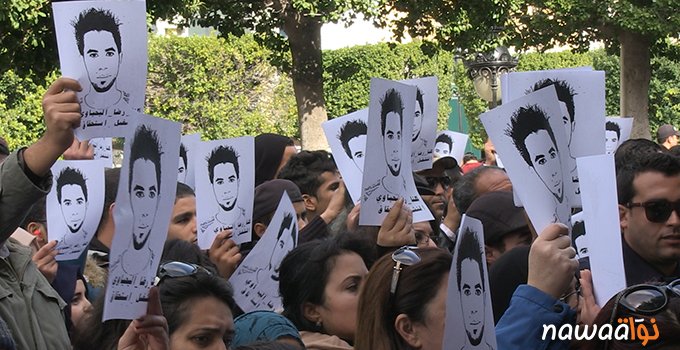 Protesters in the capital Tunis holding portraits of Ridha Yahyaoui. Photo by Nawaat.org 