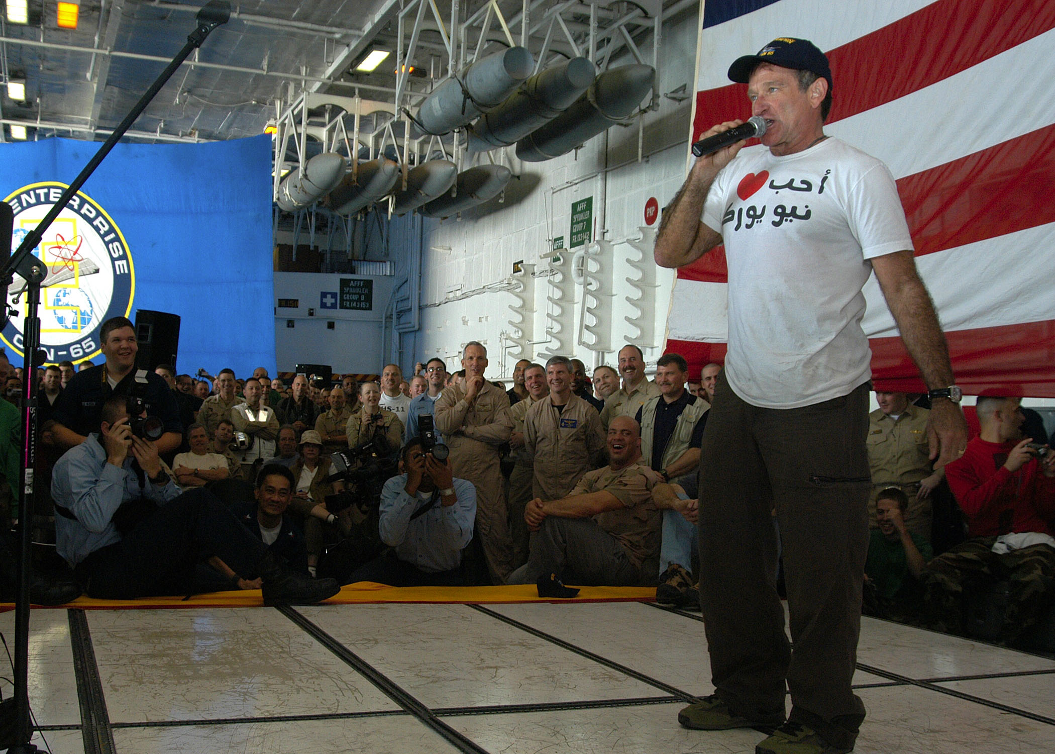  Robin Williams performing for US troops in the Middle East in 2003. Photo by Milosz Reterski. CC-Public Domain