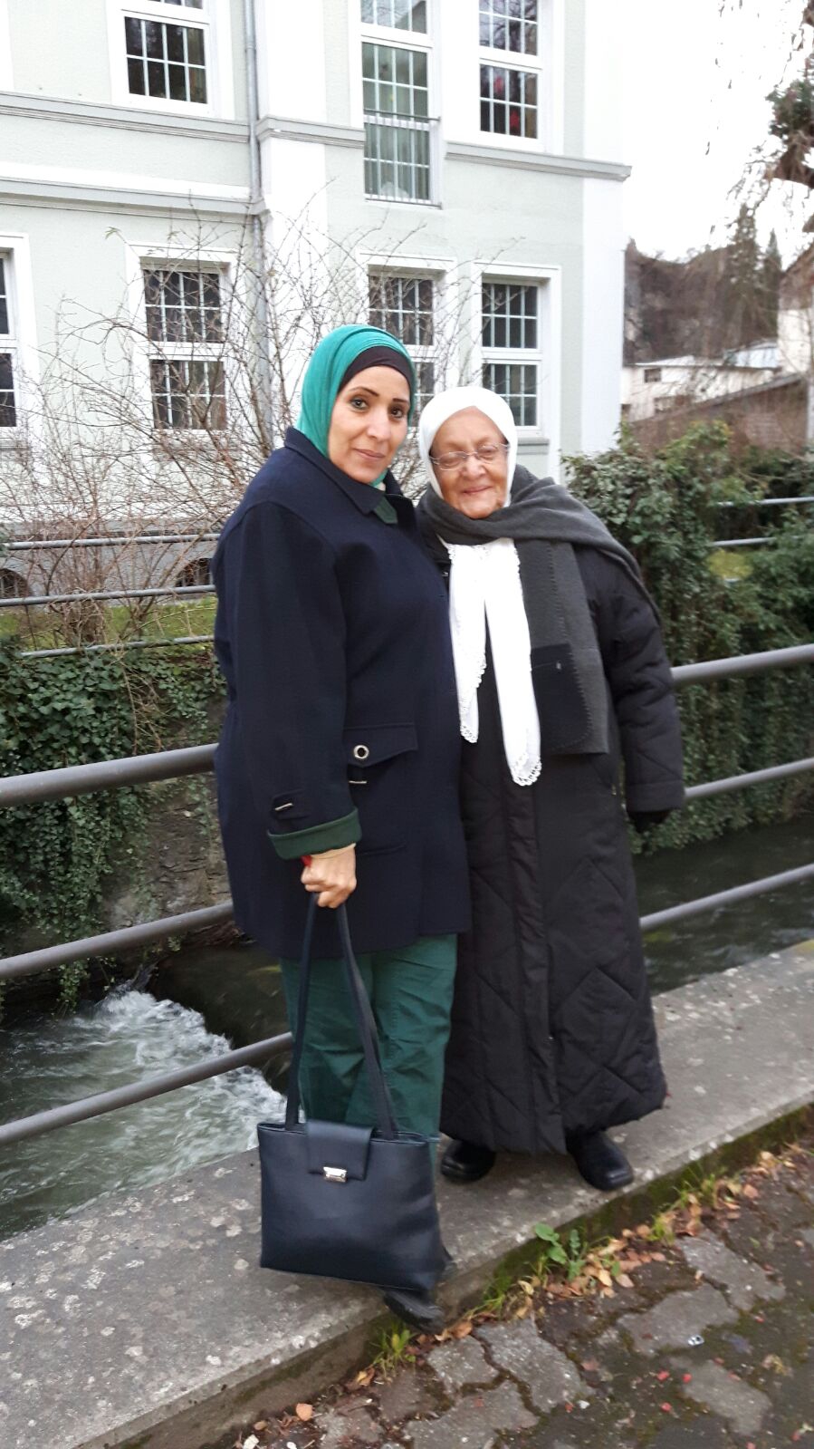 Nadera Aboud, with her daughter Mona (l). Credit: Rebecca Collard. Used with PRI's permission