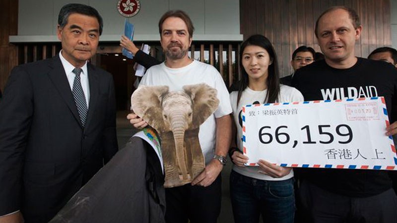 One day before the Hong Kong government policy address, wild life conservation organizations presented 66,159 signatures to the chief executive, demanding a ban on the domestic ivory trade. Photo: WildAid HK / Twitter