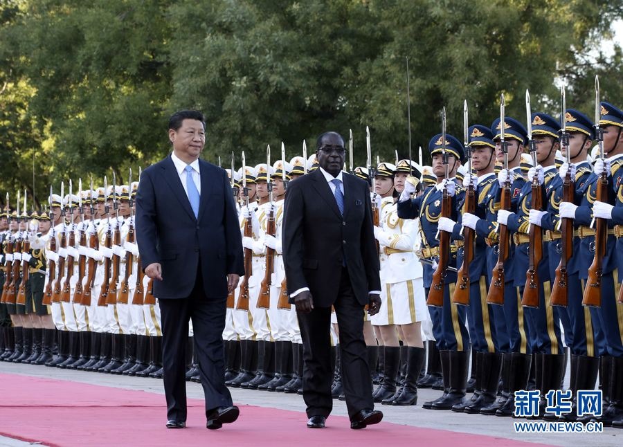 Chinese president Xi Jinping welcomed Zimbabwe President Mugabe's visit in August 2014. Photo from Xinhua.