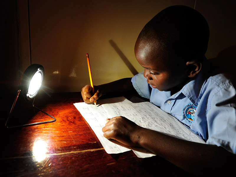 Reliable electricity is coming to more of Sub-Saharan Africa. In this photo, a student studies in Zambia. Photo by Flickr user SolarAid Photos. CC-BY-NC-SA 2.0