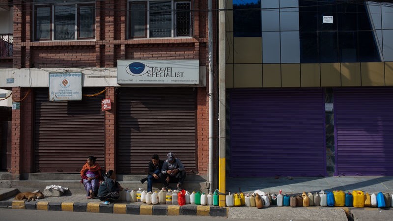 In BhatBatheni, Kathmandu, people queue for Kerasine. Two months after the gas, petrol and medicine shortages started people are still queuing for Kerasine and other fuels necessary for daily life in Kathmandu. Image by Samuel Duggan. Copyright Demotix (29/11/2015)