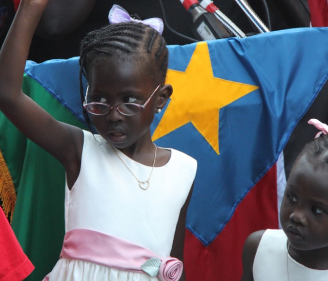 A South Sudanese girl at independence festivities: Is there a bright future for this Sudanese girl who celebrated independence in 2011? Public domain image -- original by Jonathan Morgenstein/USAID on Flickr.