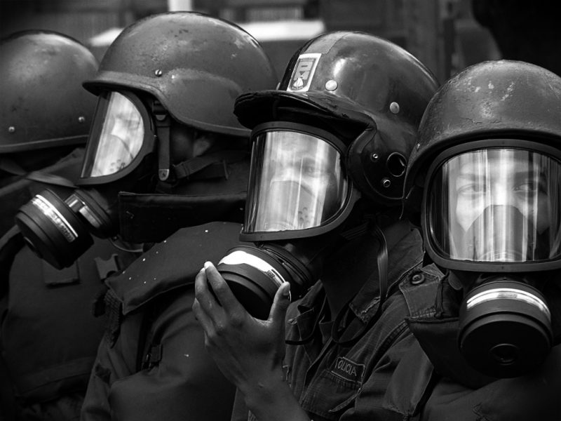 Policemen getting ready. Photo by Flickr user Rodrigo Suárez. Used under CC 2.0 license.