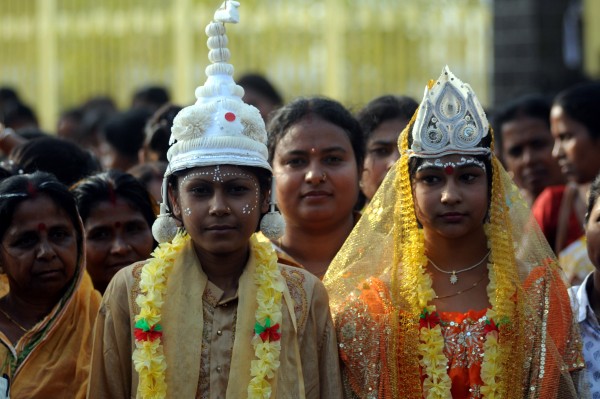 Girls dressed as young bride and groom for an awareness campaign against child bride. Agartala, India. Image by Reporter#24728. /Copyright Demotix (7/3/2012)