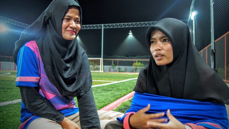 Waeasmir Waemano and Sawani Mama, students at the Pattani campus of Prince of Songkla University, say that they want society to see that women can play football, and do so even while wearing hijabs. Photo by Fadila Hamidong, courtesy of Prachatai