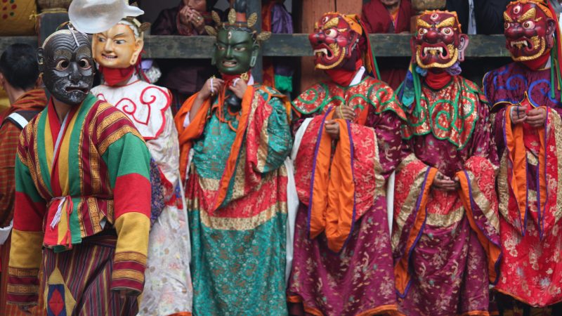 Masked dances performed in annual religious Bhutanese festival called tshechu on the tenth day of a month of the lunar Tibetan calendar. Image from Flickr by Arian Zweckers. CC BY 2.0