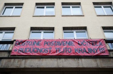 A banner on a school building in Slovakia reads: "The dignity of a teacher = The future of this country." Photo by Igor Svítok, copyright © Demotix (11/22/12).