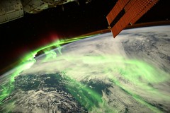 Green aurora covering Earth