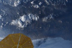 Mountains under Cygnus solar wings