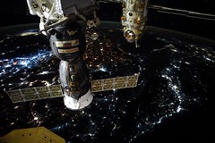 Cygnus solar panel, Soyuz, Nauka at night